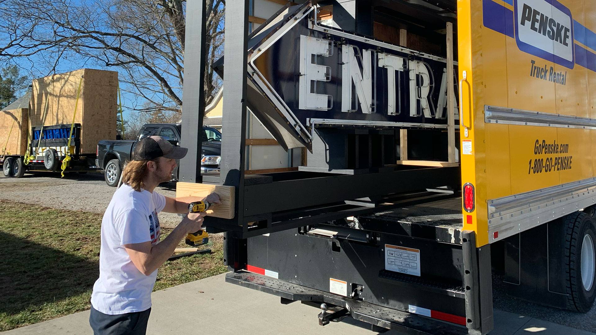 Neon road entrance sign in penske truck