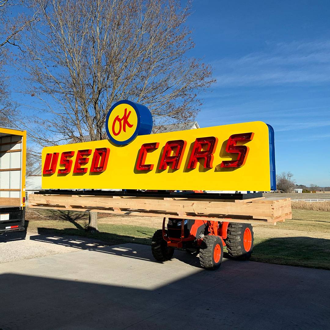 Neon road Ok used cars neon sign during restoration