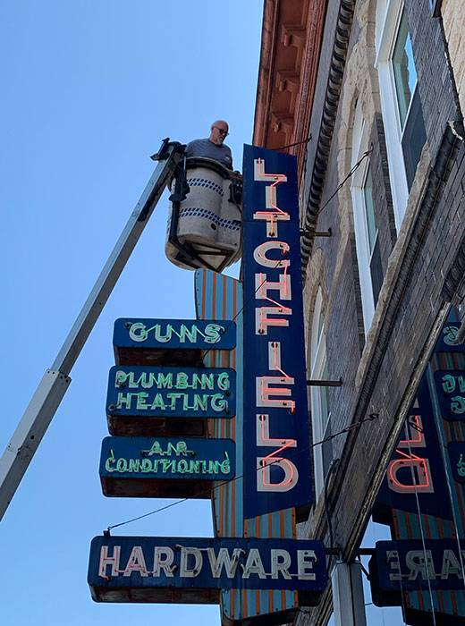 Neon road litchfield guns plumbing air conditioning sign