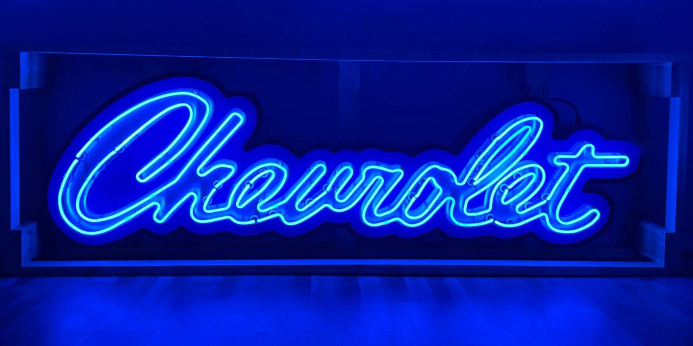 Neon road script chevrolet sign