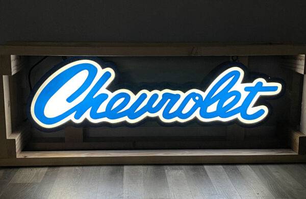 Neon road scripted chevrolet sign