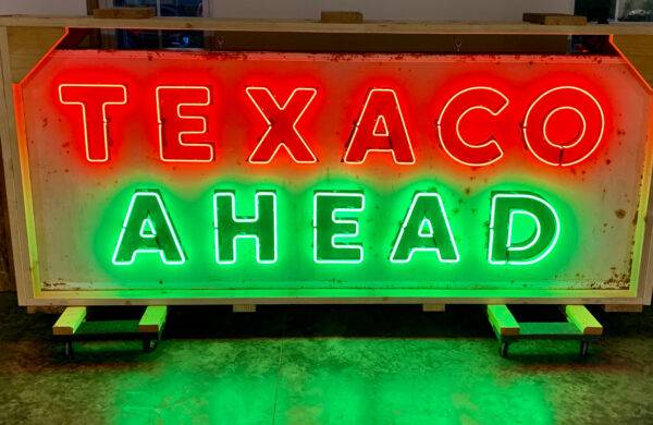 Neon Road texaco ahead red and green sign